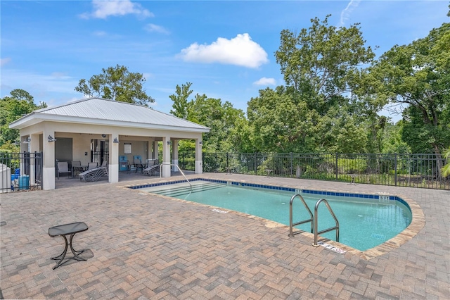 view of swimming pool with a patio area