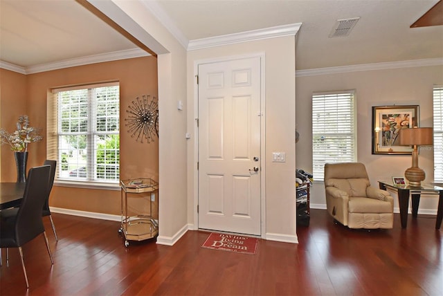 entrance foyer with crown molding and dark wood-type flooring