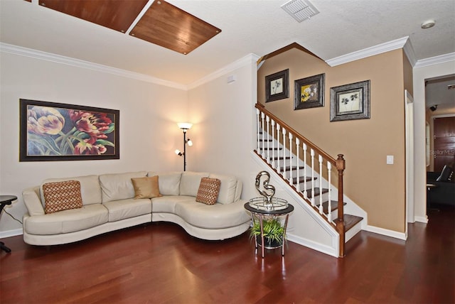 living room with a textured ceiling, hardwood / wood-style floors, and ornamental molding