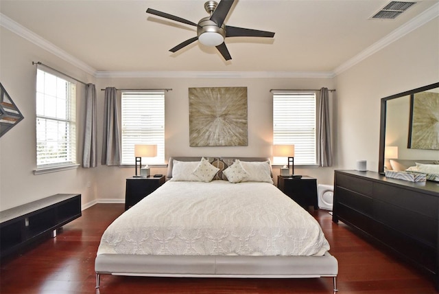 bedroom featuring ornamental molding, dark hardwood / wood-style flooring, and ceiling fan