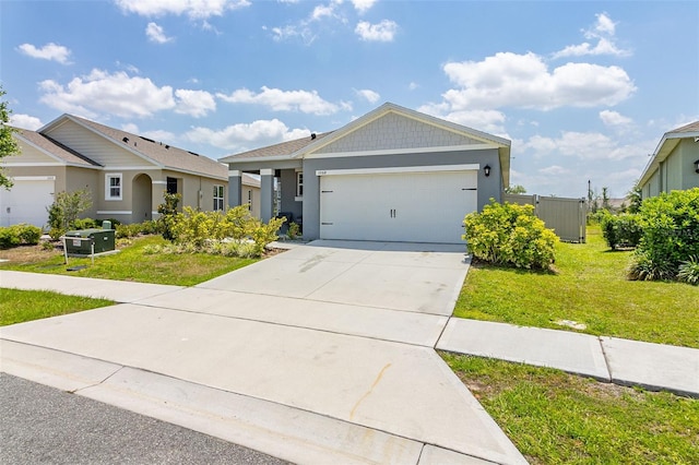 view of front of home with a garage and a front lawn