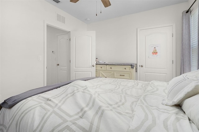 bedroom with ceiling fan and a closet