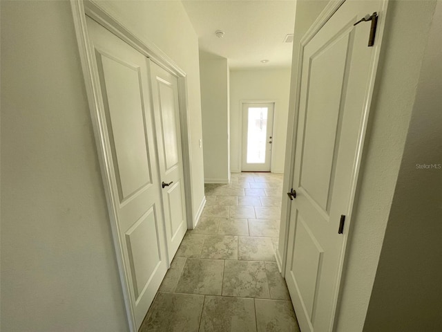 corridor with tile flooring