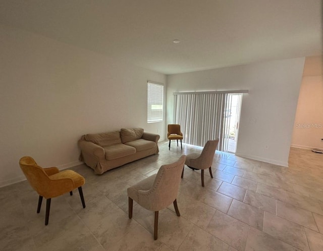 living room featuring light tile flooring