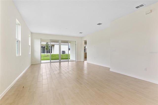 spare room featuring light wood-type flooring