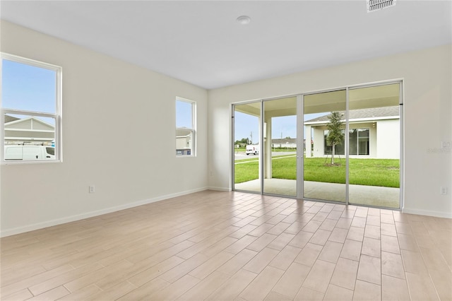 unfurnished room featuring light hardwood / wood-style flooring