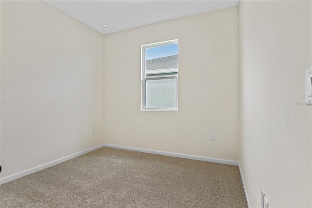 spare room featuring carpet floors