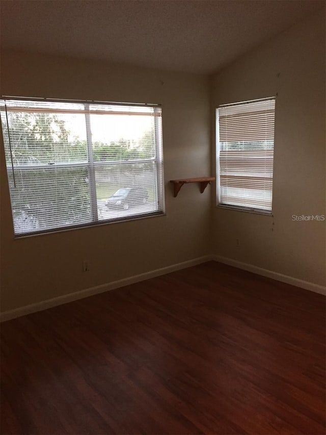 unfurnished room featuring wood-type flooring