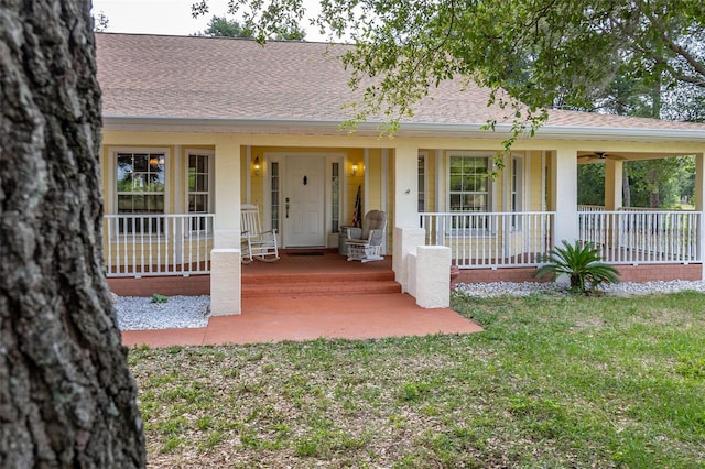 single story home with a front yard and a porch