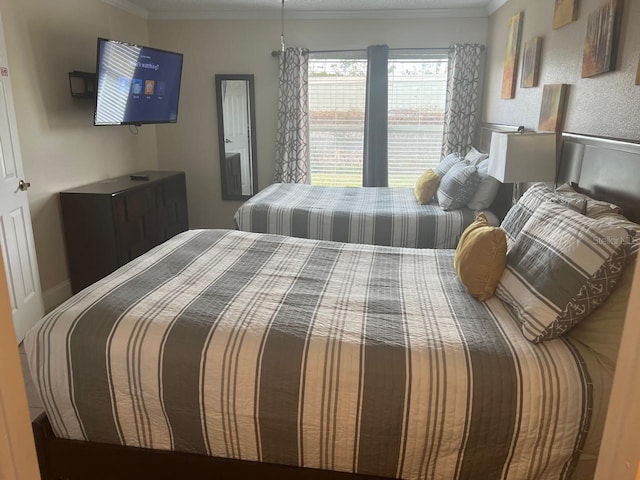 bedroom with ornamental molding