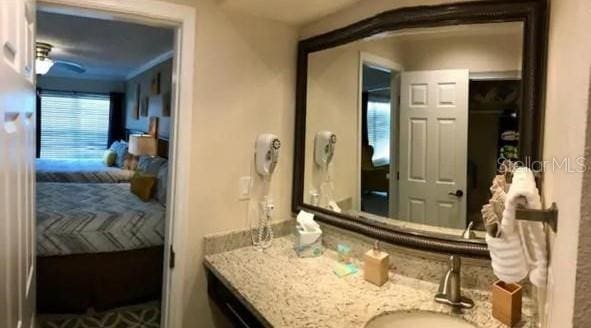 bathroom featuring vanity and ceiling fan