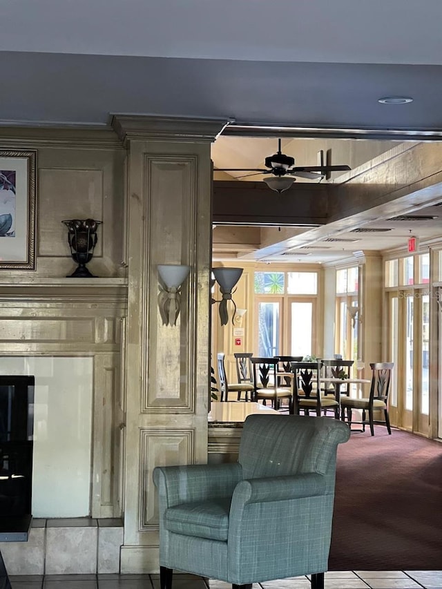 carpeted living room with ceiling fan