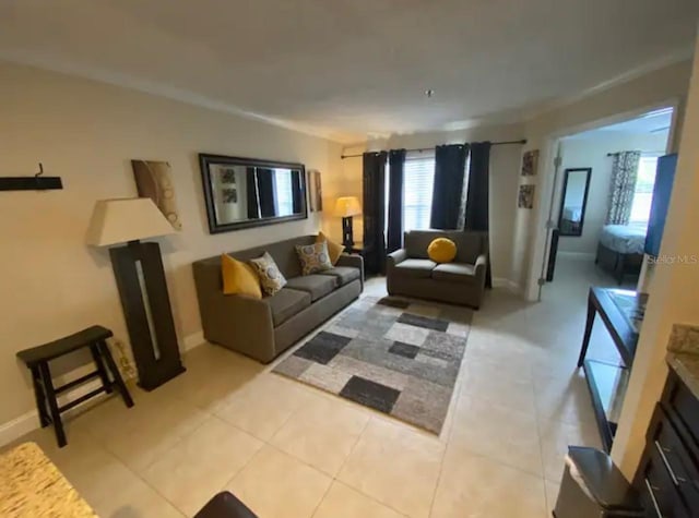 3100 Parkway Blvd Unit 717, Kissimmee, FL 34747 - living area with plenty of natural light, light tile patterned floors, and baseboards