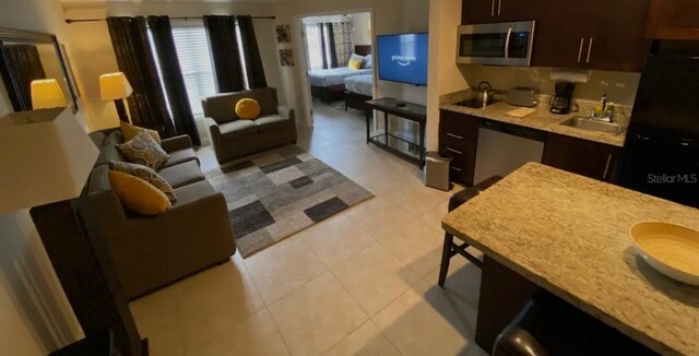 3100 Parkway Blvd Unit 717, Kissimmee, FL 34747 - living area featuring light tile patterned flooring