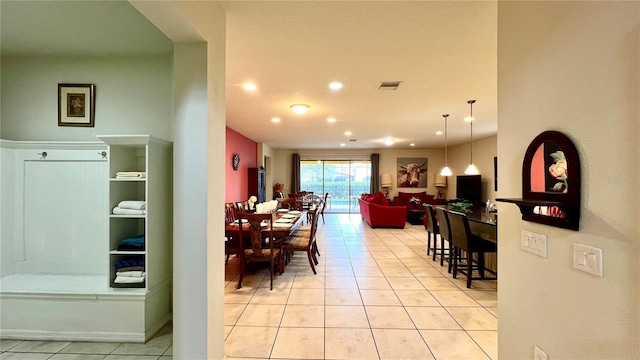 dining area with light tile patterned floors