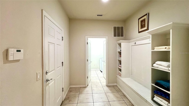 mudroom with light tile patterned floors