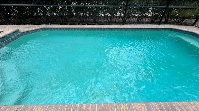 view of pool featuring a lanai