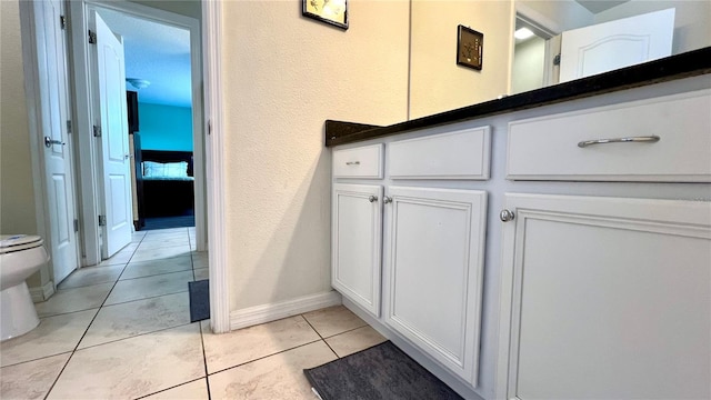 bathroom featuring tile patterned floors and toilet