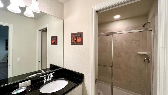 bathroom with vanity and an enclosed shower