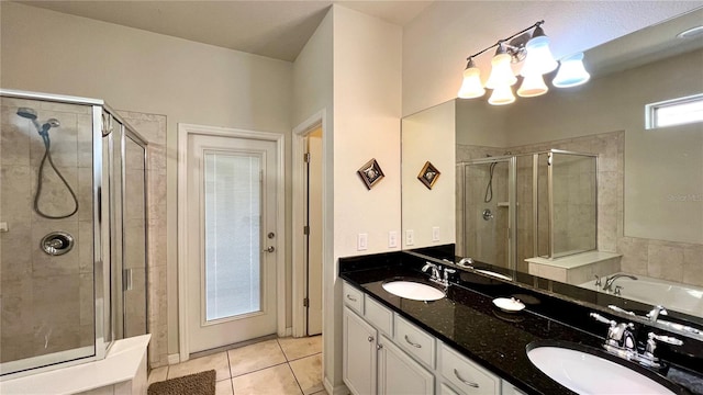 bathroom featuring tile patterned floors, a chandelier, vanity, and a shower with shower door