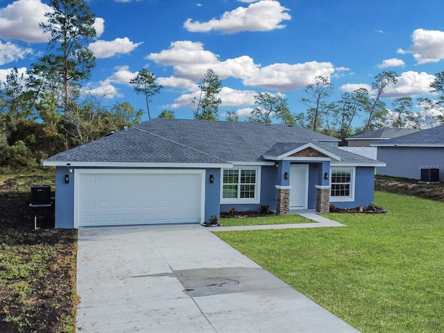 ranch-style home with a front yard, central AC unit, and a garage