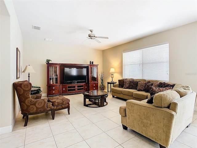 tiled living room with ceiling fan