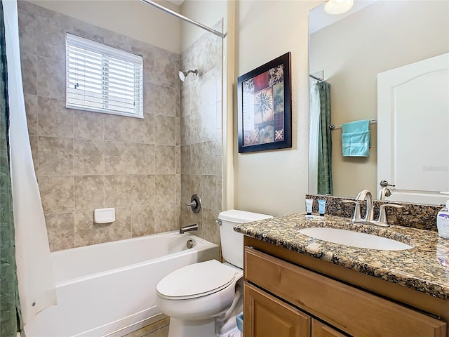 full bathroom featuring vanity, toilet, and shower / tub combo