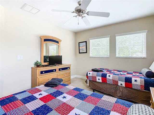 carpeted bedroom with ceiling fan