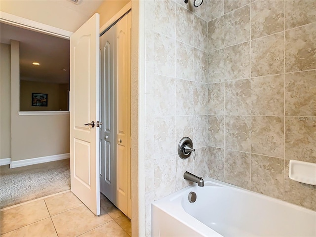 bathroom with tiled shower / bath and tile patterned floors