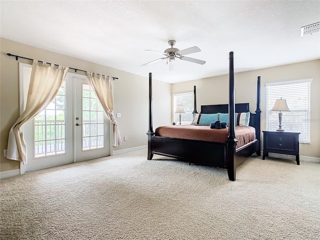 bedroom featuring french doors, ceiling fan, light carpet, and access to outside