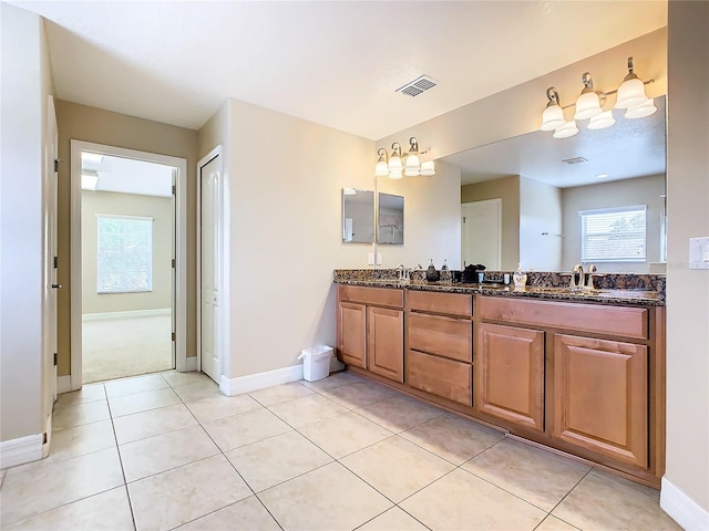 bathroom with vanity and tile patterned flooring