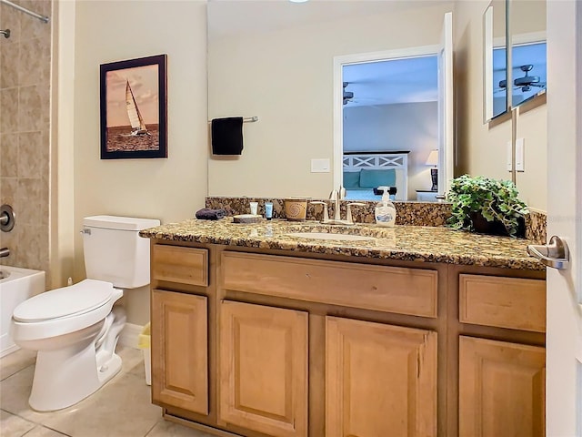 full bathroom featuring vanity, toilet, tile patterned flooring, and tiled shower / bath