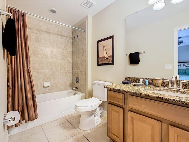 full bathroom featuring vanity, toilet, tile patterned floors, and shower / bath combo