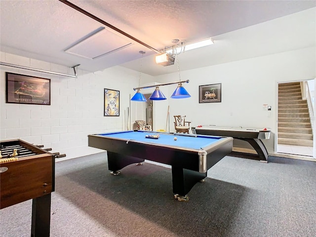 game room featuring a textured ceiling, pool table, and carpet floors