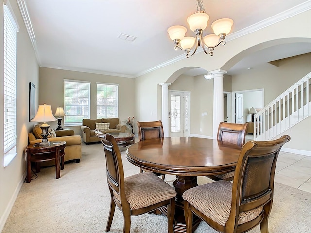 dining space featuring crown molding and a notable chandelier