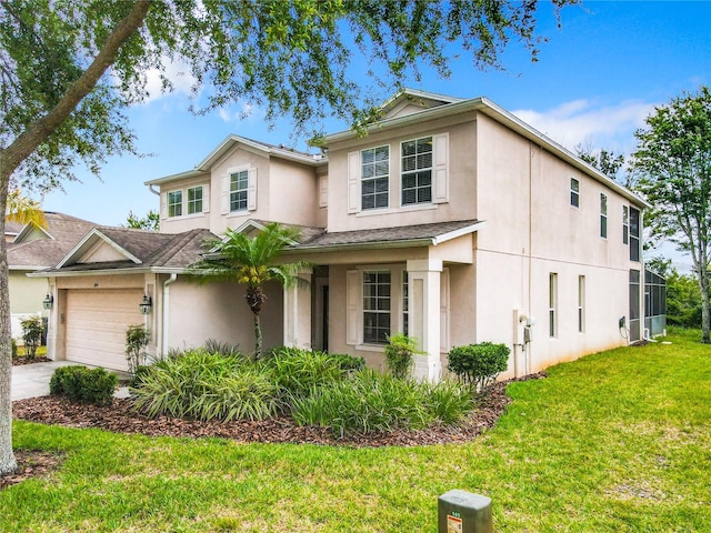 view of front of house featuring a front yard and a garage