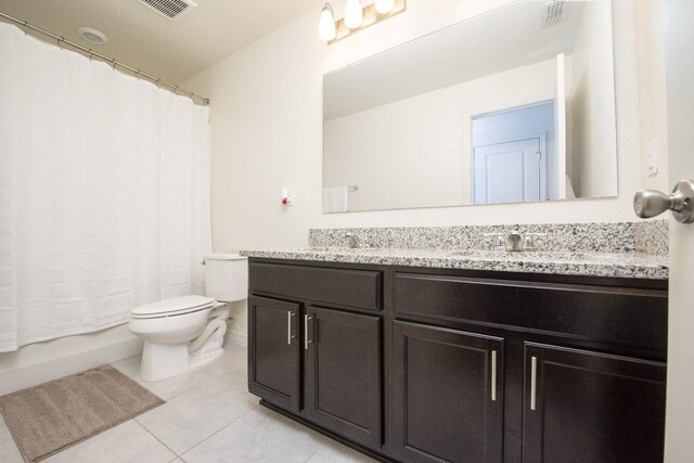 full bathroom with tile patterned flooring, vanity, shower / bath combination with curtain, and toilet