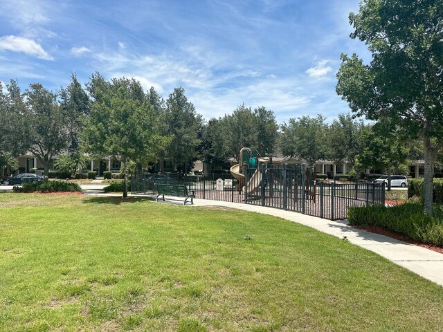 surrounding community featuring a yard and a playground