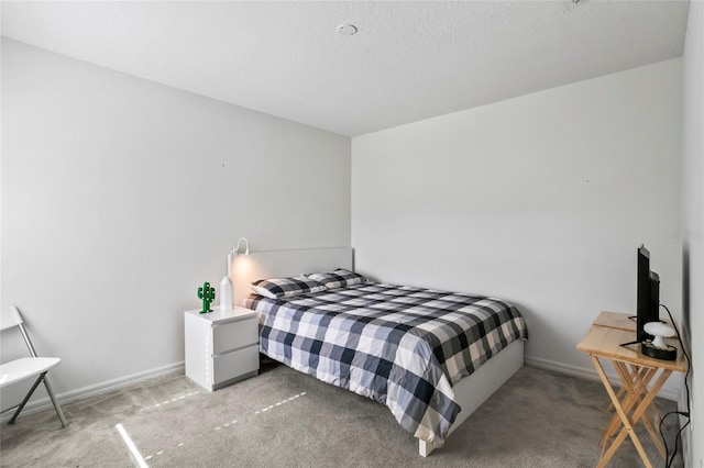 carpeted bedroom with baseboards