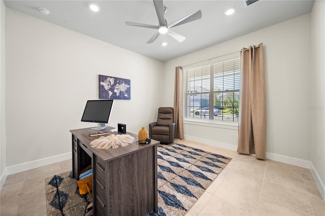 home office with ceiling fan and light tile floors