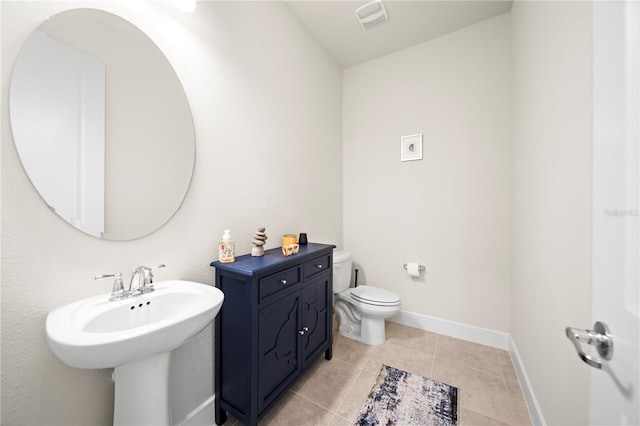 bathroom with tile floors and toilet