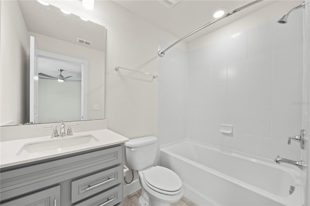 full bathroom with ceiling fan, toilet, tiled shower / bath combo, tile flooring, and large vanity