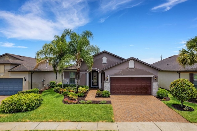 single story home with a garage and a front yard