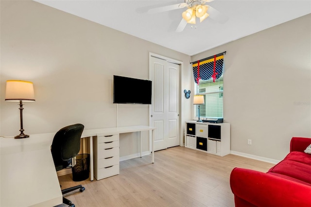 home office with ceiling fan and light wood-type flooring