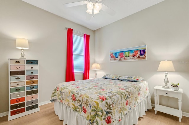 bedroom featuring hardwood / wood-style flooring and ceiling fan