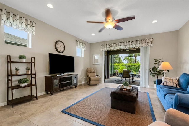 living room featuring ceiling fan and light tile patterned floors