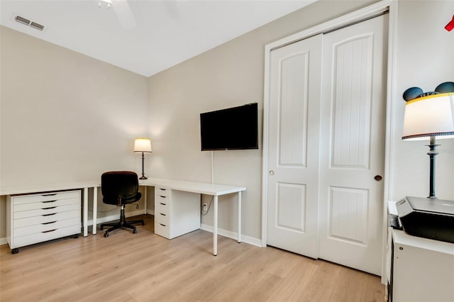 office with ceiling fan and light hardwood / wood-style flooring