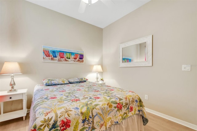 bedroom with ceiling fan and light hardwood / wood-style flooring