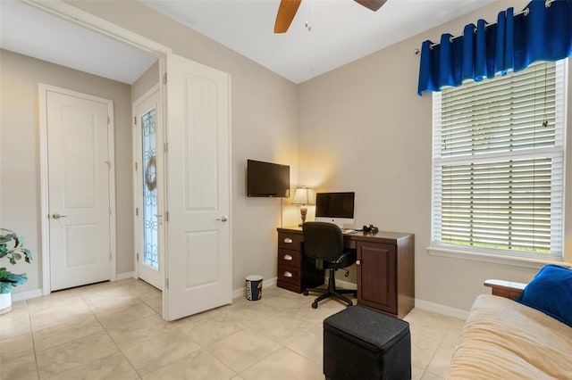 tiled office space with ceiling fan