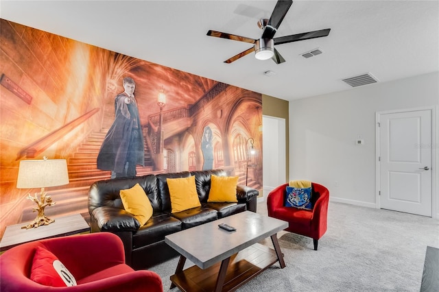 carpeted living room featuring ceiling fan and wood walls